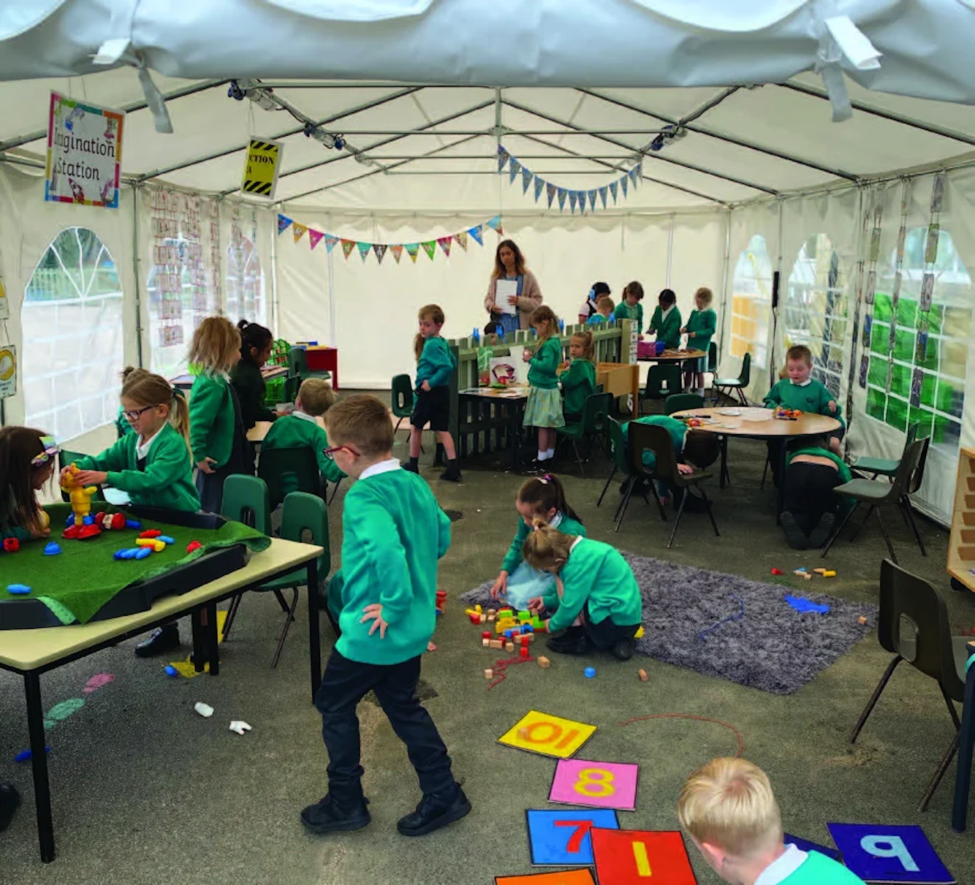 Children playing in the marquee